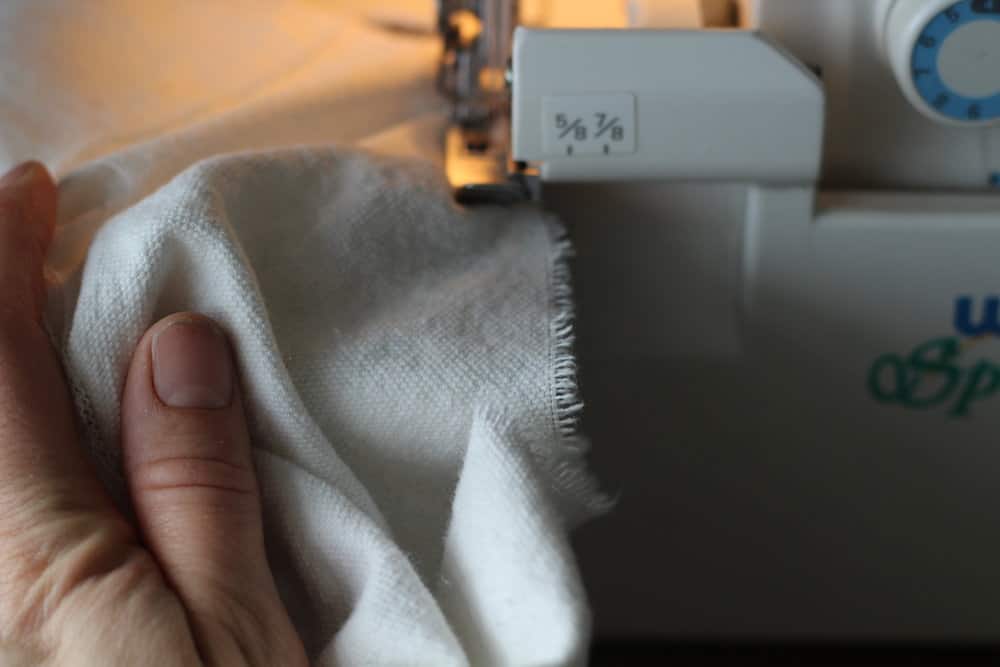 drop cloth going through a serger to keep the edges from fraying