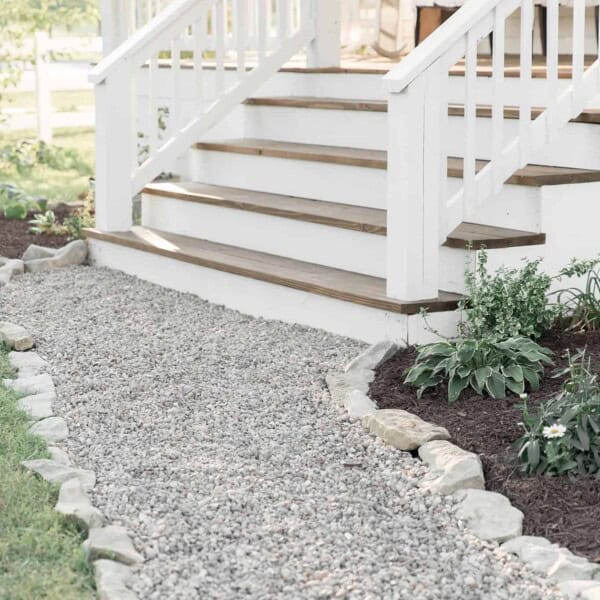 See how our farmhouse front porch steps look after we covered the concrete with wood