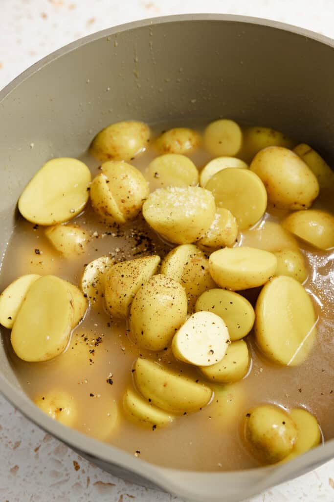 potatoes and chicken broth added to the pot.