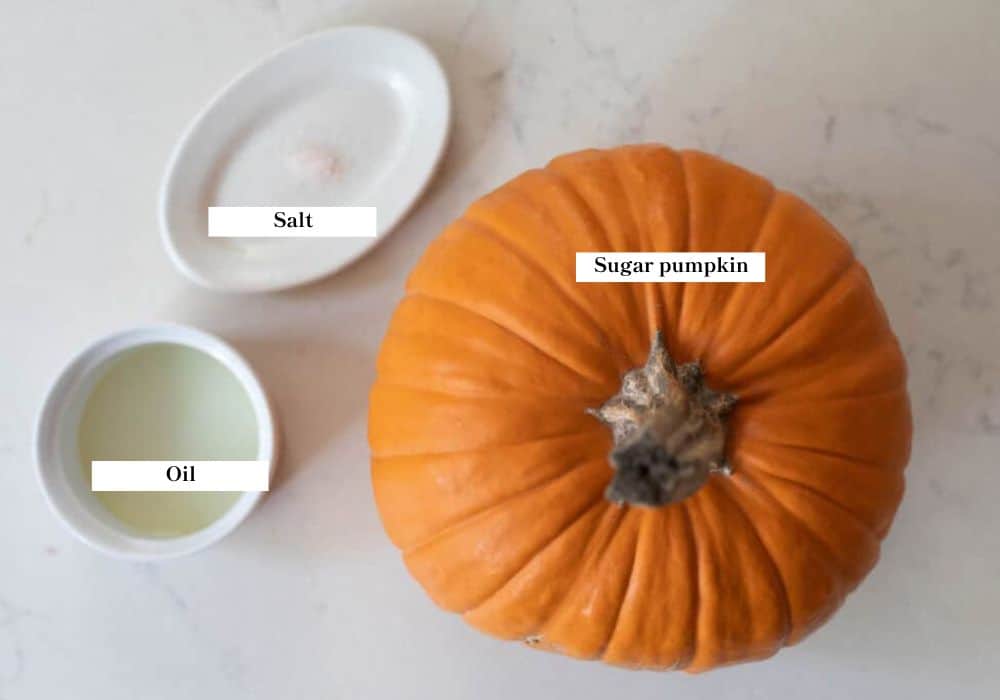 A pie pumpkin and bowl of oil and a pinch of salt.