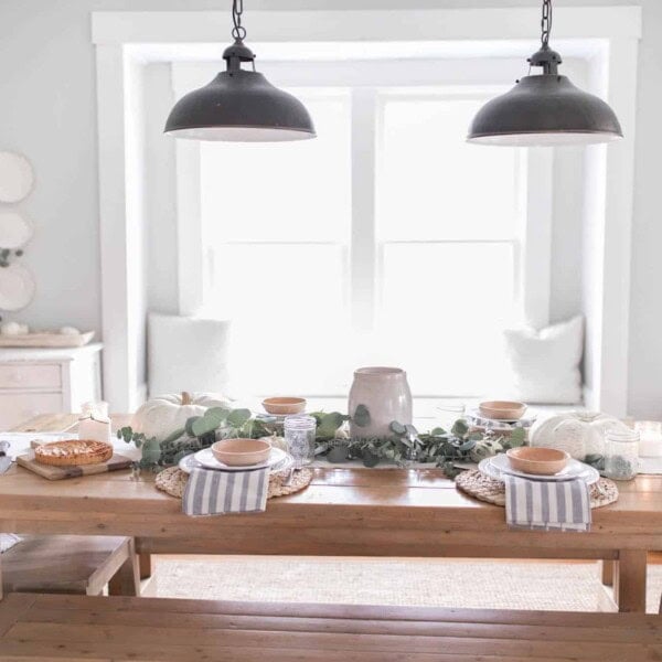 Farmhouse Thanksgiving Tablescape with pumpkins and eucalyptus