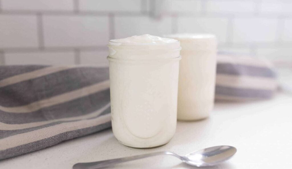 raw milk in two mason jars on a counter