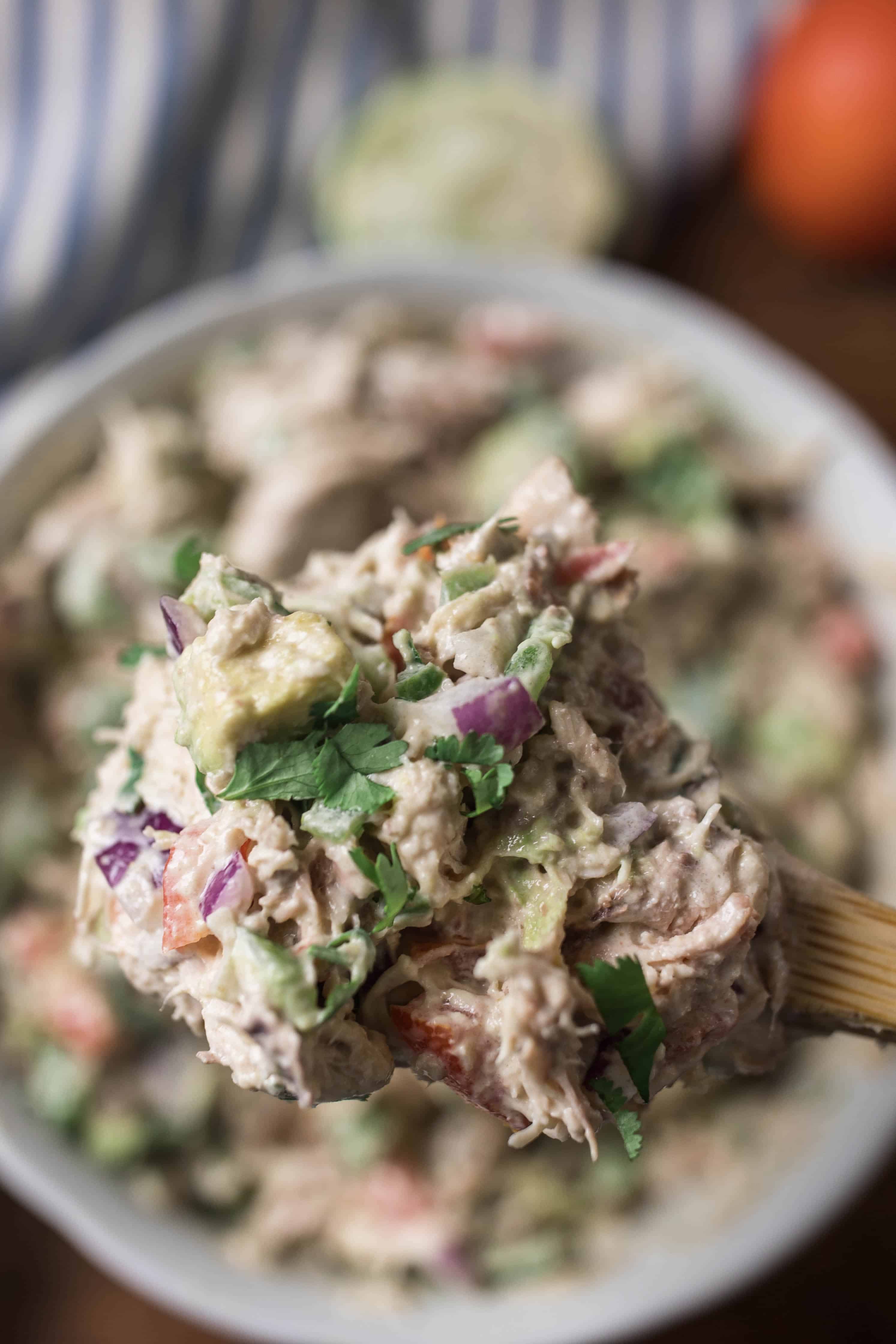 scooping out a serving of southwest chicken salad.