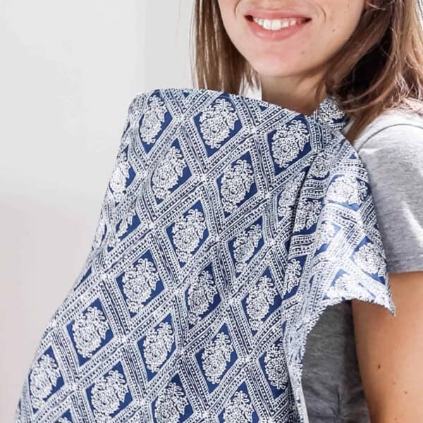 women wearing a blue and white paisley patterned DIY nursing cover