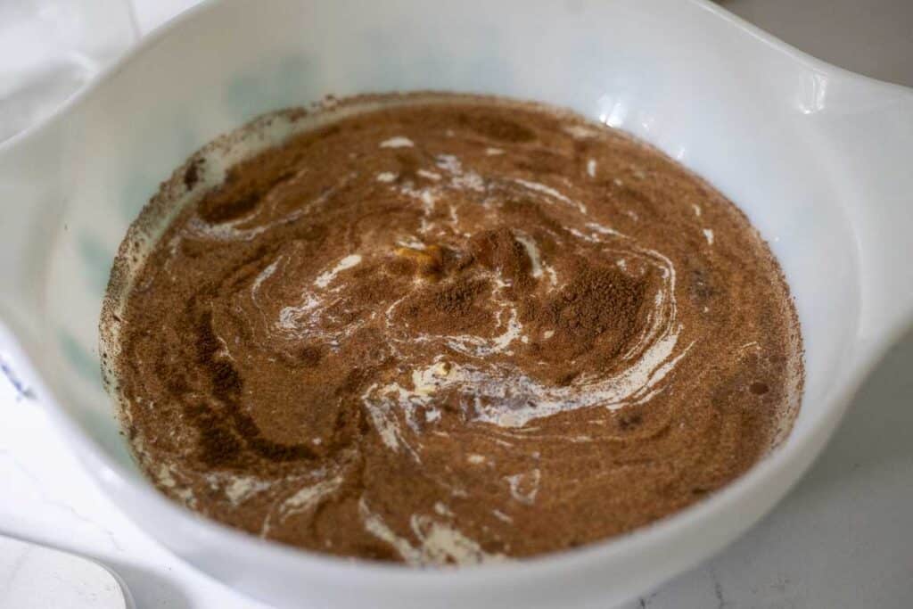 Pumpkin ice cream ingredients in a bowl.