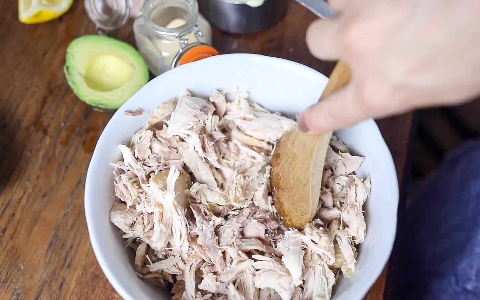 shredded chicken in a bowl to make southwest chicken salad.