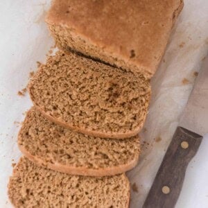 einkorn sandwich bread sliced up with a knife to the right