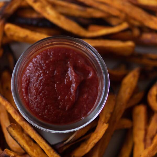 close up overhead photo of fermented ketchup in the middle of sweet potato fries