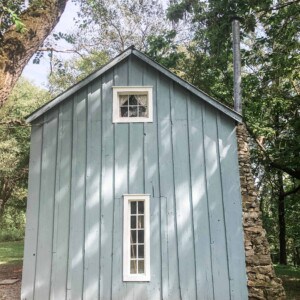 blue cottage with farmhouse window trim