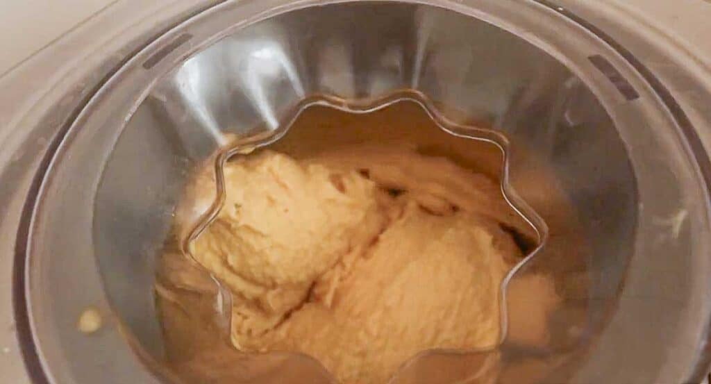 chai ice cream churning in an ice cream maker.