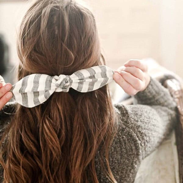 women wearing a stripped DIY scrunch bow