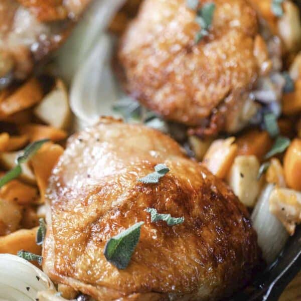 crispy maple roasted chicken with sweet potatoes and apples.