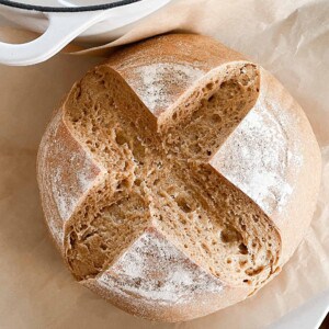 overhead photo of einkorn sourdough bread on. parchment paper