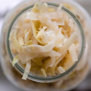 overhead photo of a jar full of homemade sauerkraut