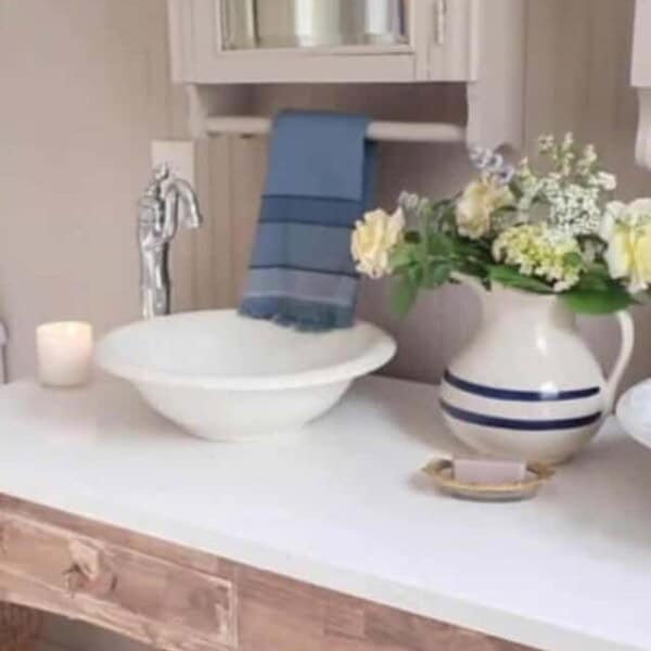 bathroom vanity with two ceramic bowls for sinks