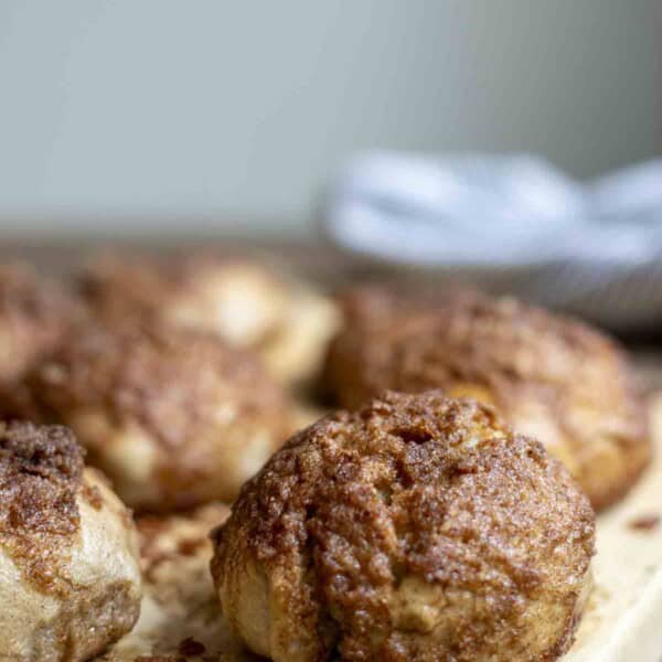 sourdough cinnamon crunch bagels on a wood cutting board