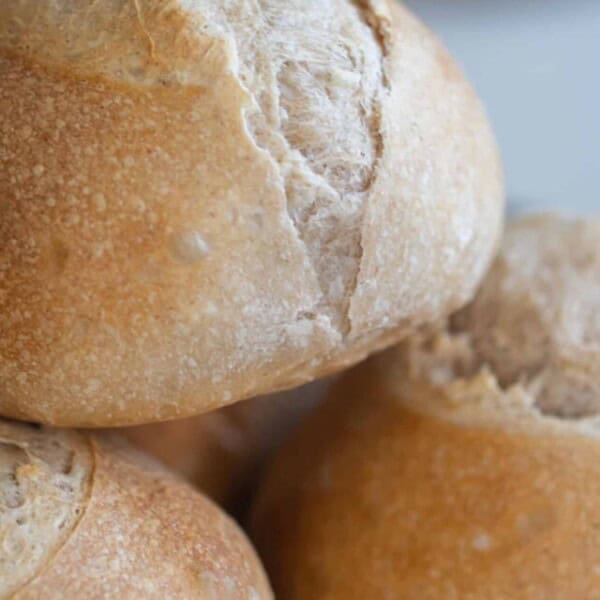 three loaves of mini sourdough bread stacked on each other