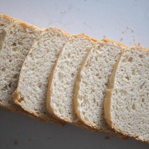 Slices of pain de mie bread layered in a horizontal line