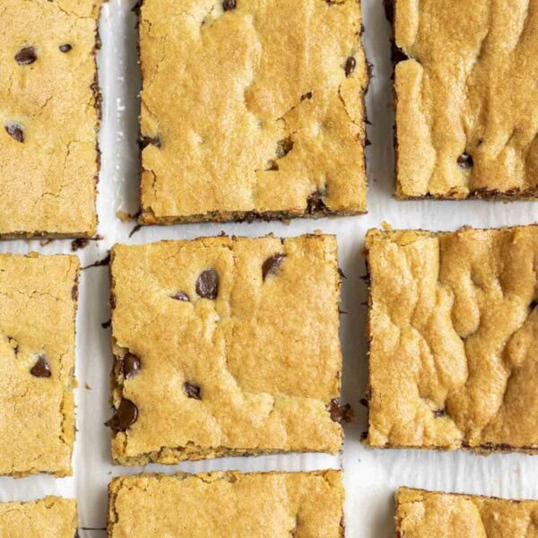 sourdough blondies cut into squares on parchment paper