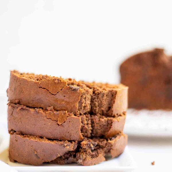 three slices of sourdough discard chocolate bread stacked on a plate