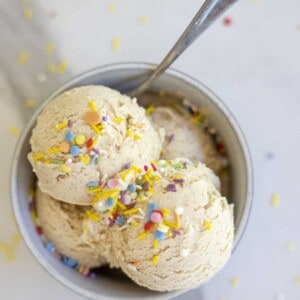 A bowl of date ice cream with sprinkles on top.