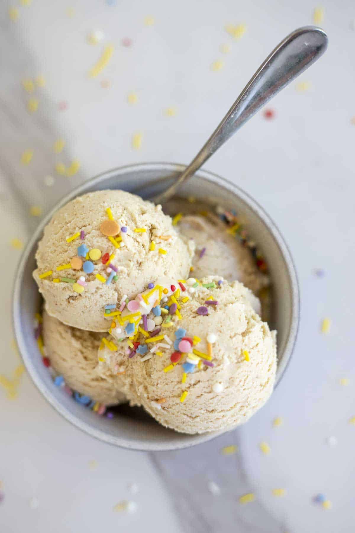 A bowl of date ice cream with sprinkles on top.