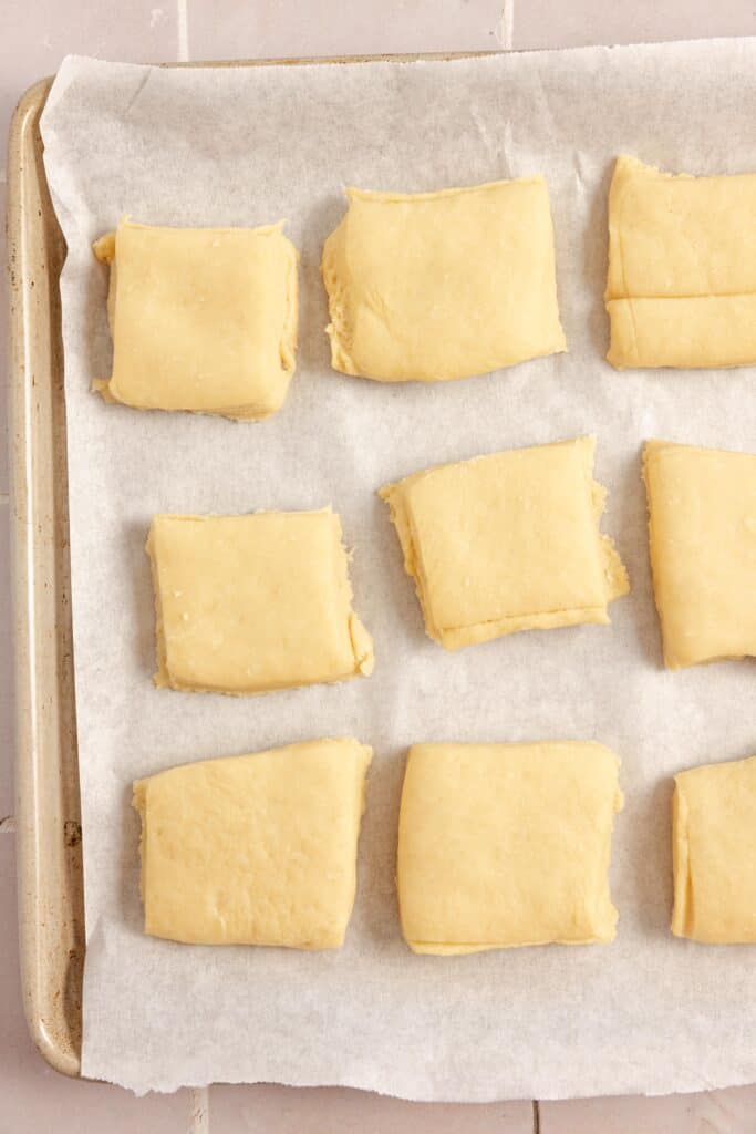 Puffy dough on parchment paper.