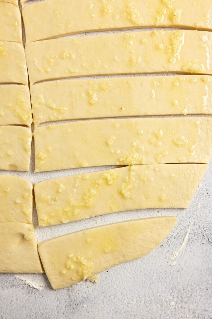 Dough rolled out and cut out into rectangles.