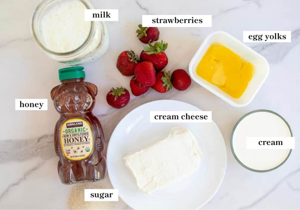 Strawberry cheesecake ice cream ingredients spread out on a countertop.