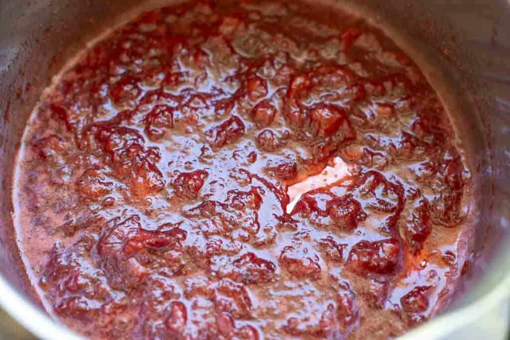 Strawberry sauce in a saucepan.