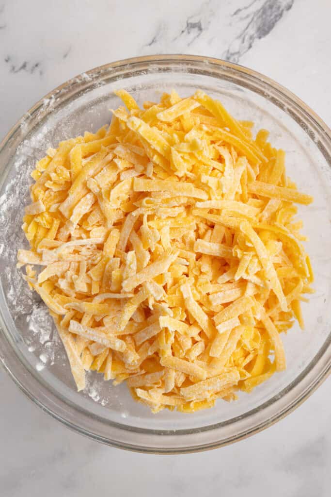 shredded cheddar cheese with cornstarch.