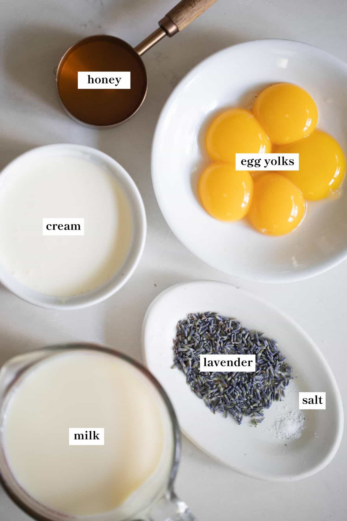 lavender ice cream ingredients in white bowls.