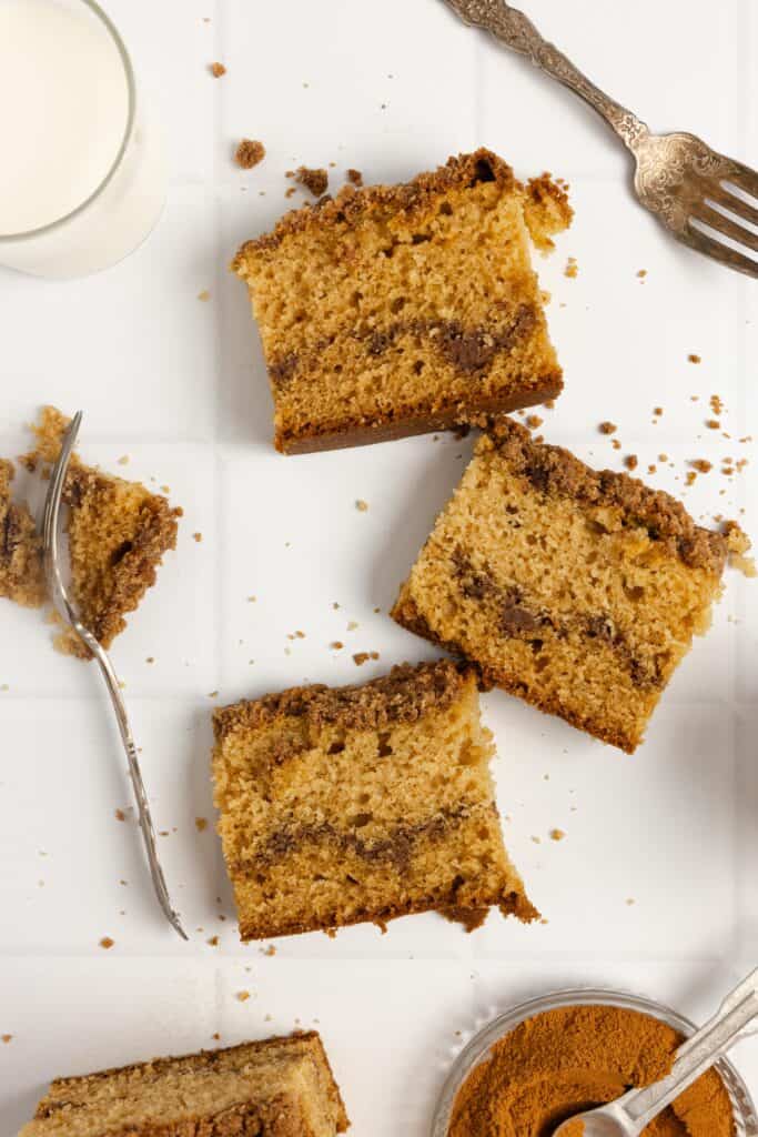 Three slices of sourdough coffee cake on a white countertop.