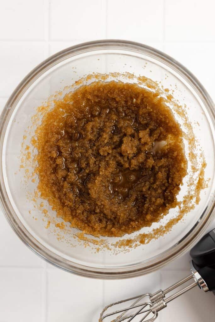 Brown sugar, sugar, and butter in a glass bowl.