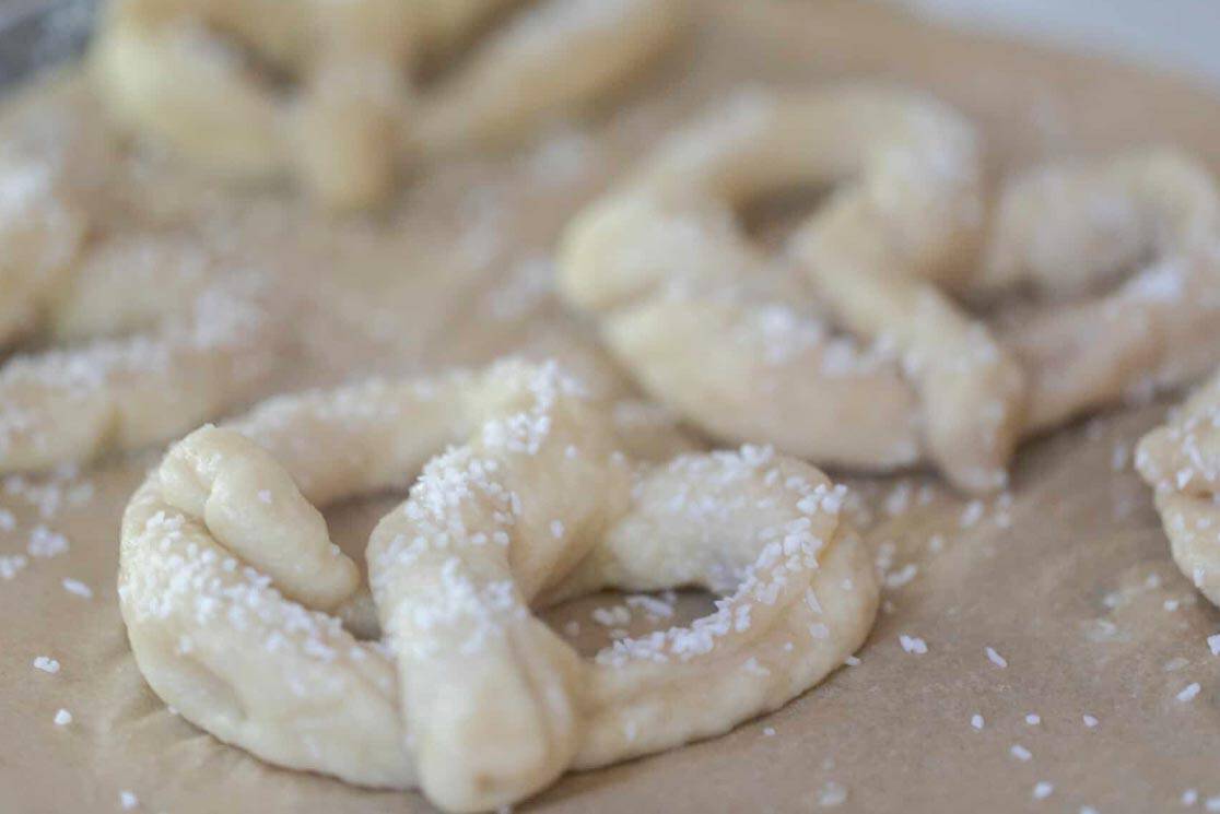 unbaked pretzels brushed with egg wash and topped with coarse sea salt.