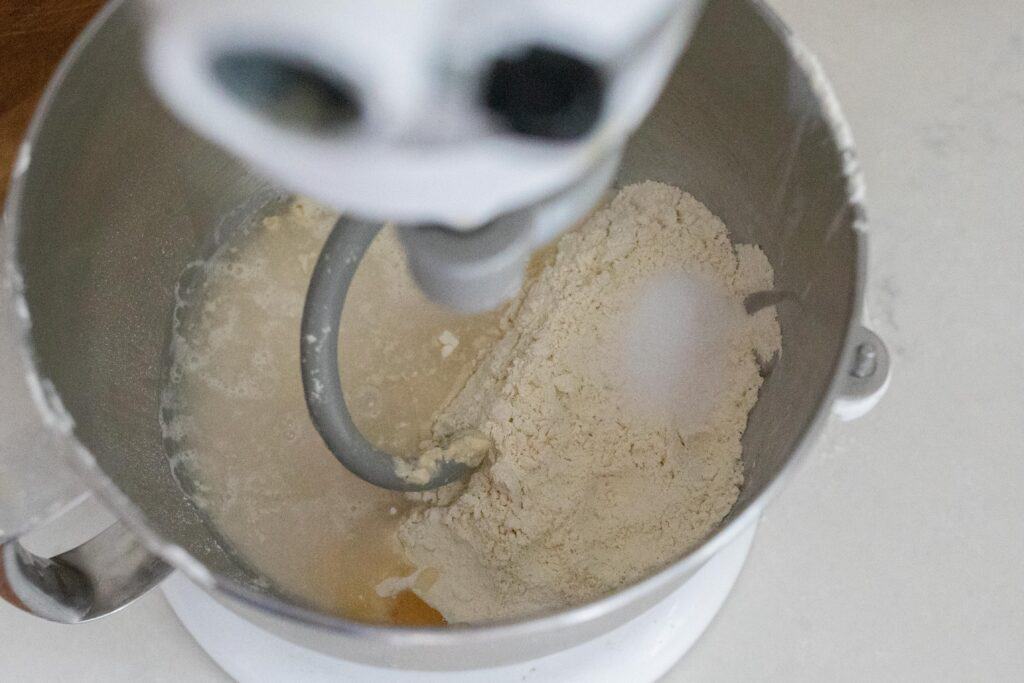 flour, honey, sourdough starter, and water in a stand mixer.