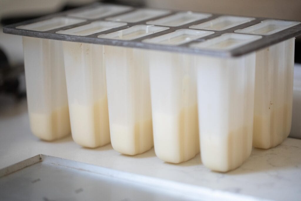 Yogurt layered into a popsicle mold.