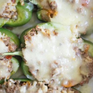 Stuffed bell peppers topped with mozzarella cheese.