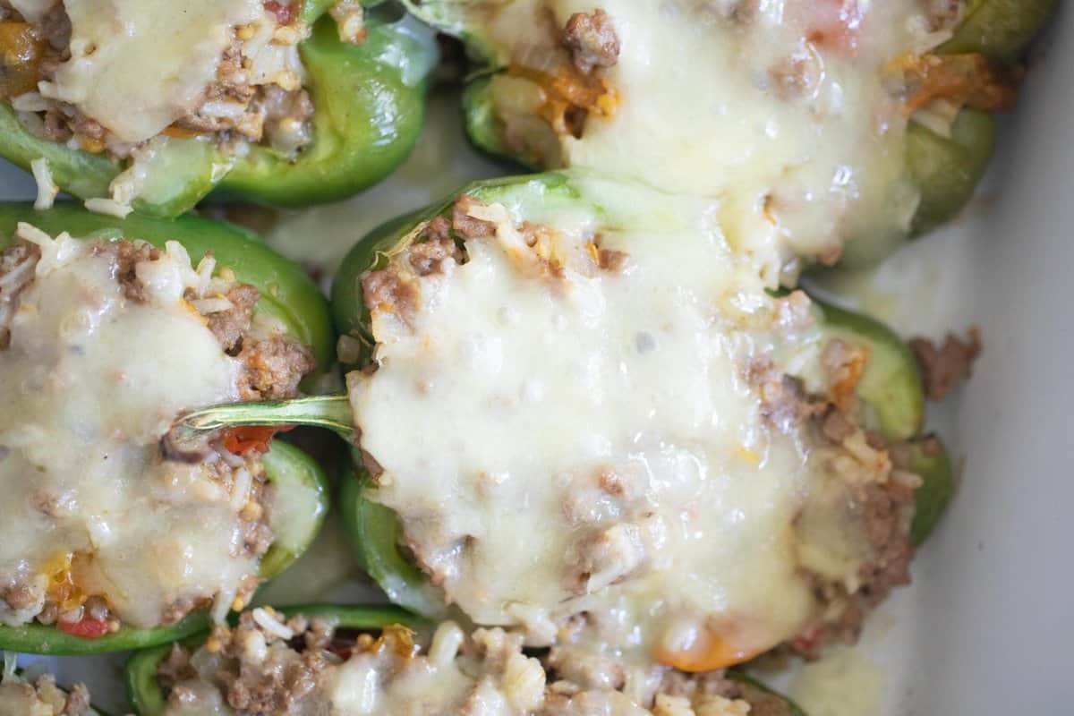 Stuffed bell peppers topped with mozzarella cheese.