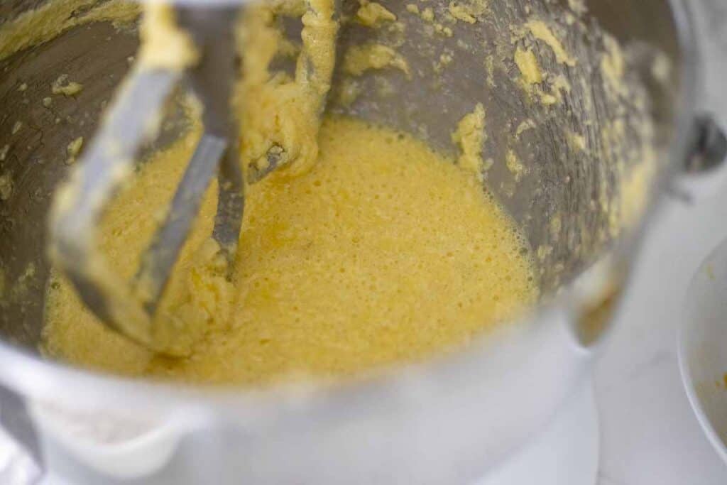 liquid ingredients mixed together in a stand mixer bowl.