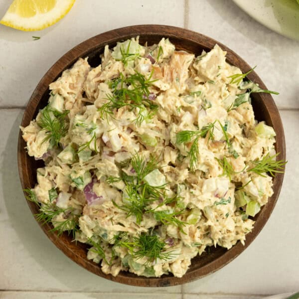 Tuna salad in a wooden serving bowl.