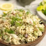 Tuna salad in a wooden serving bowl.