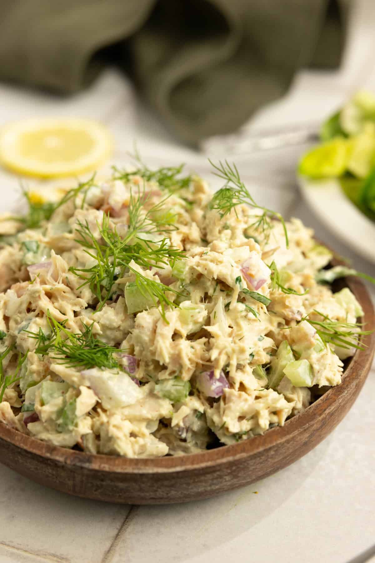 Tuna salad in a wooden serving bowl. 