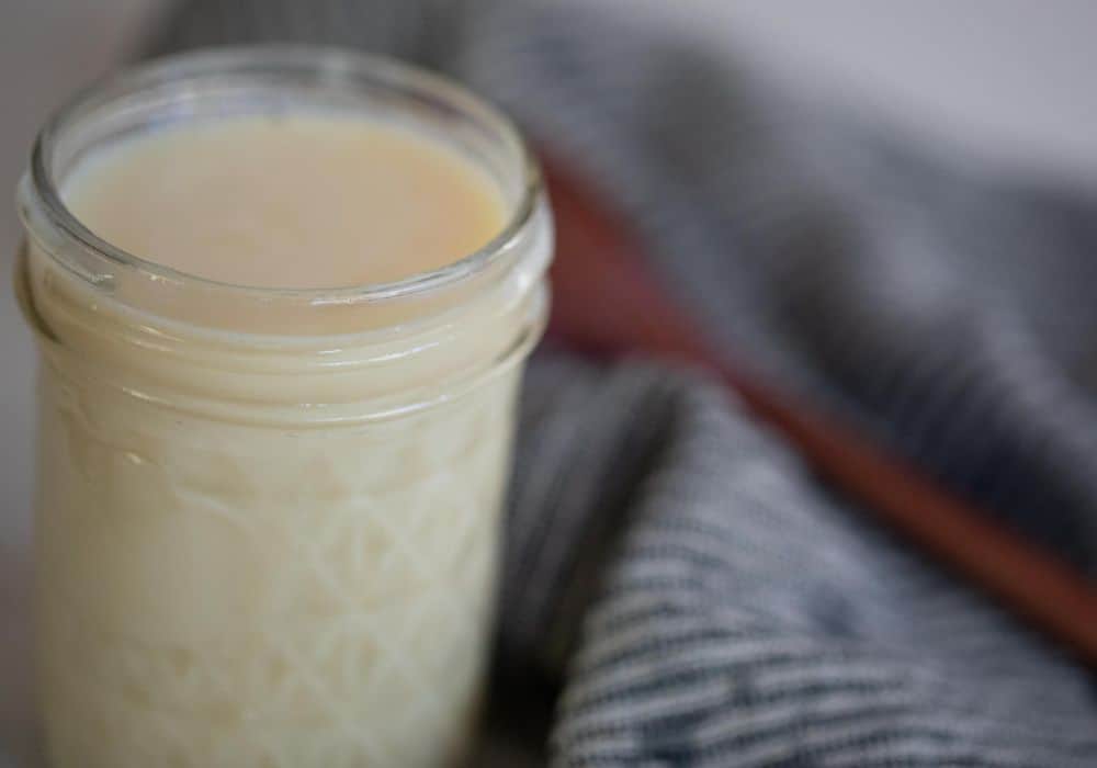 A jar of homemade sweetened condensed milk. 