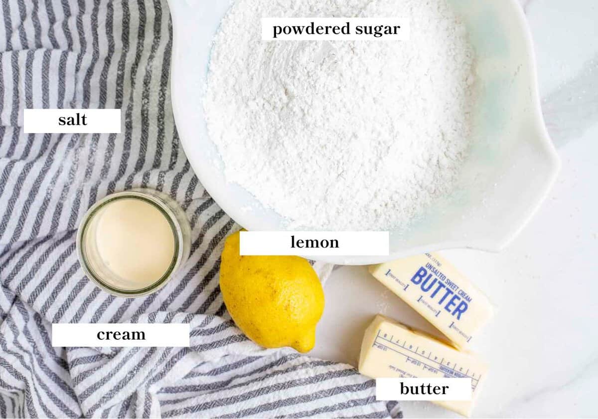 lemon frosting ingredients spread out on a countertop.