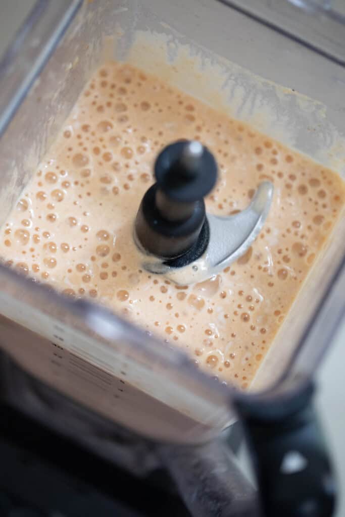 pumpkin smoothie blended in a blender.