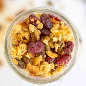 overhead photo of sourdough granola in a mason jar.