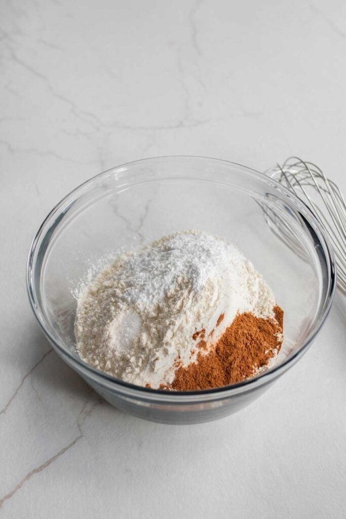 Dry ingredients for scones in a clear bowl.