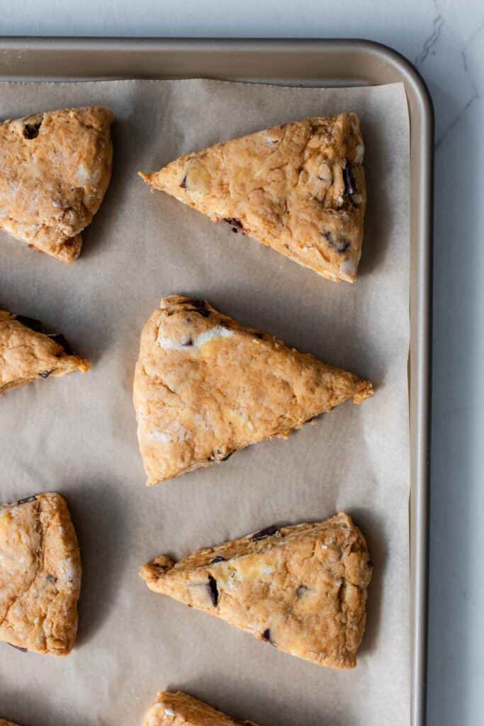 Sourdough scones on a baking sheet ready to be baked.