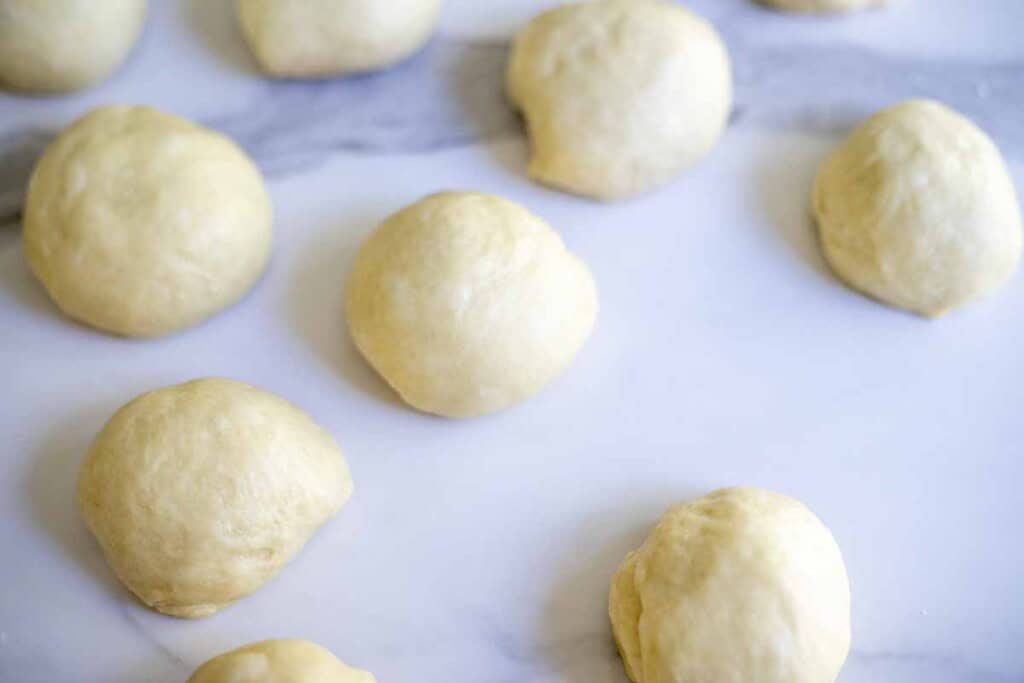 Sourdough brioche roll dough on a countertop.